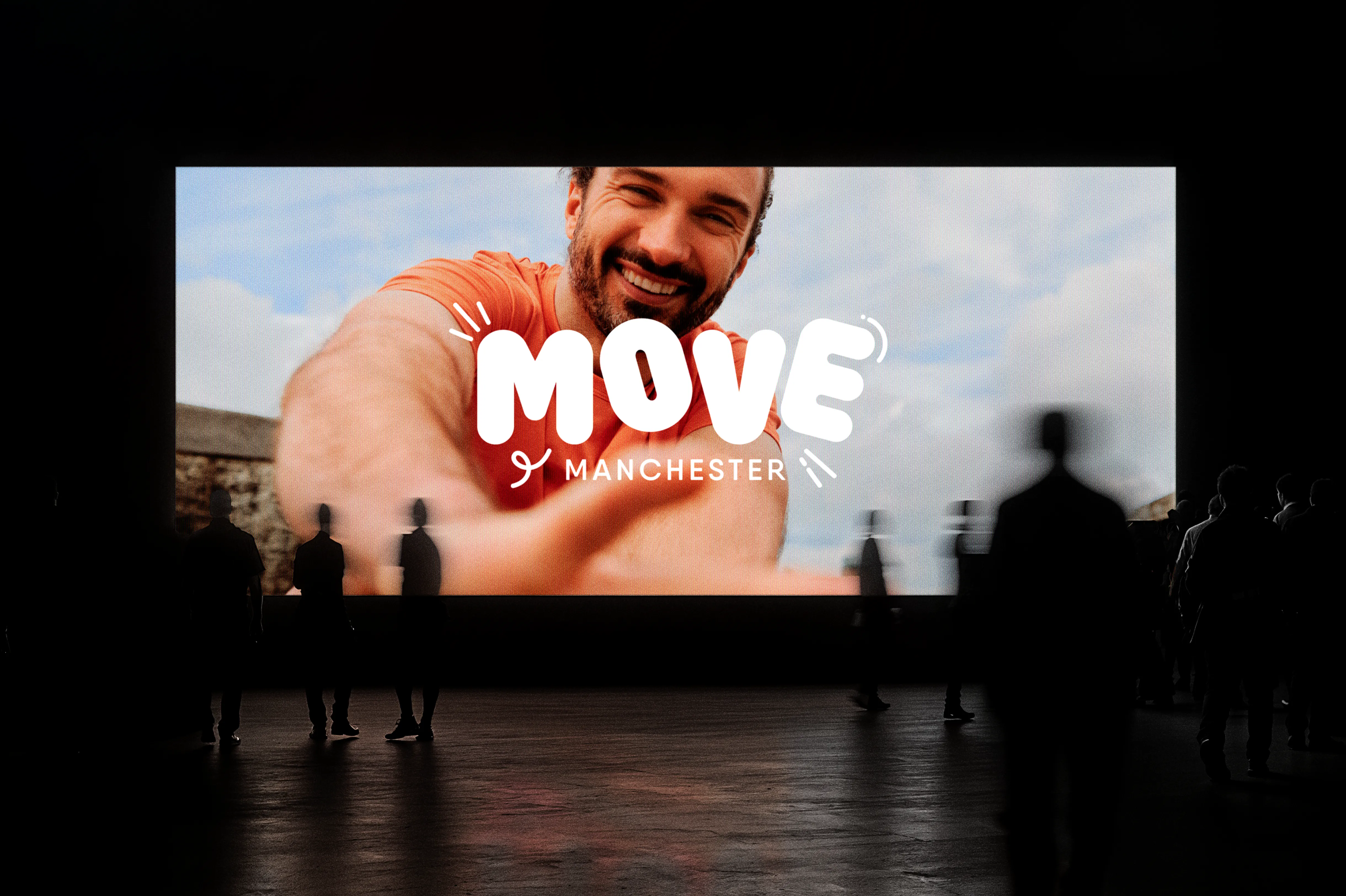 Move logo and a photo of Joe Wicks on a large screen