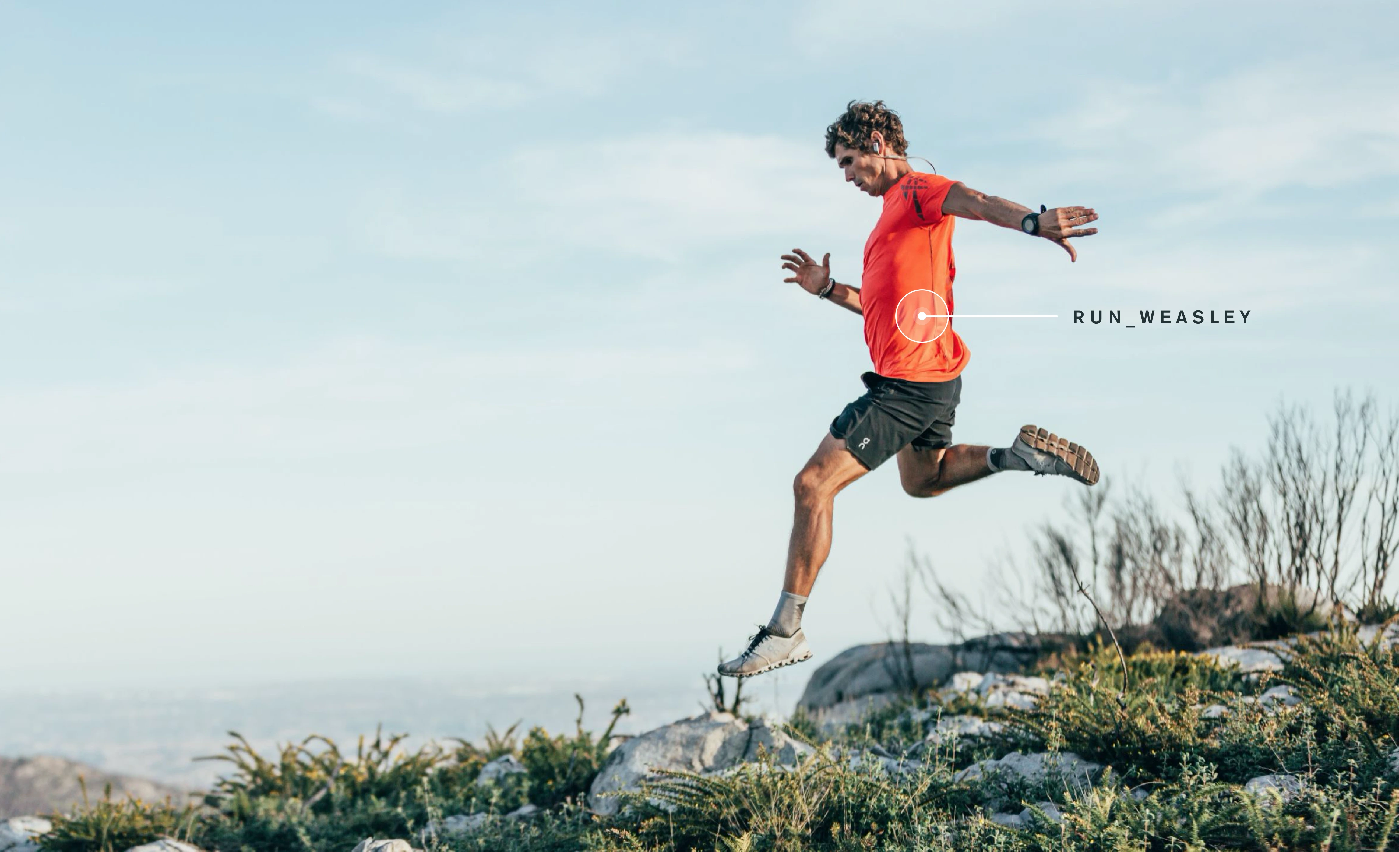A runner moving across rocky terrain, with game visuals from Run_Weasley emerging from their movement.
